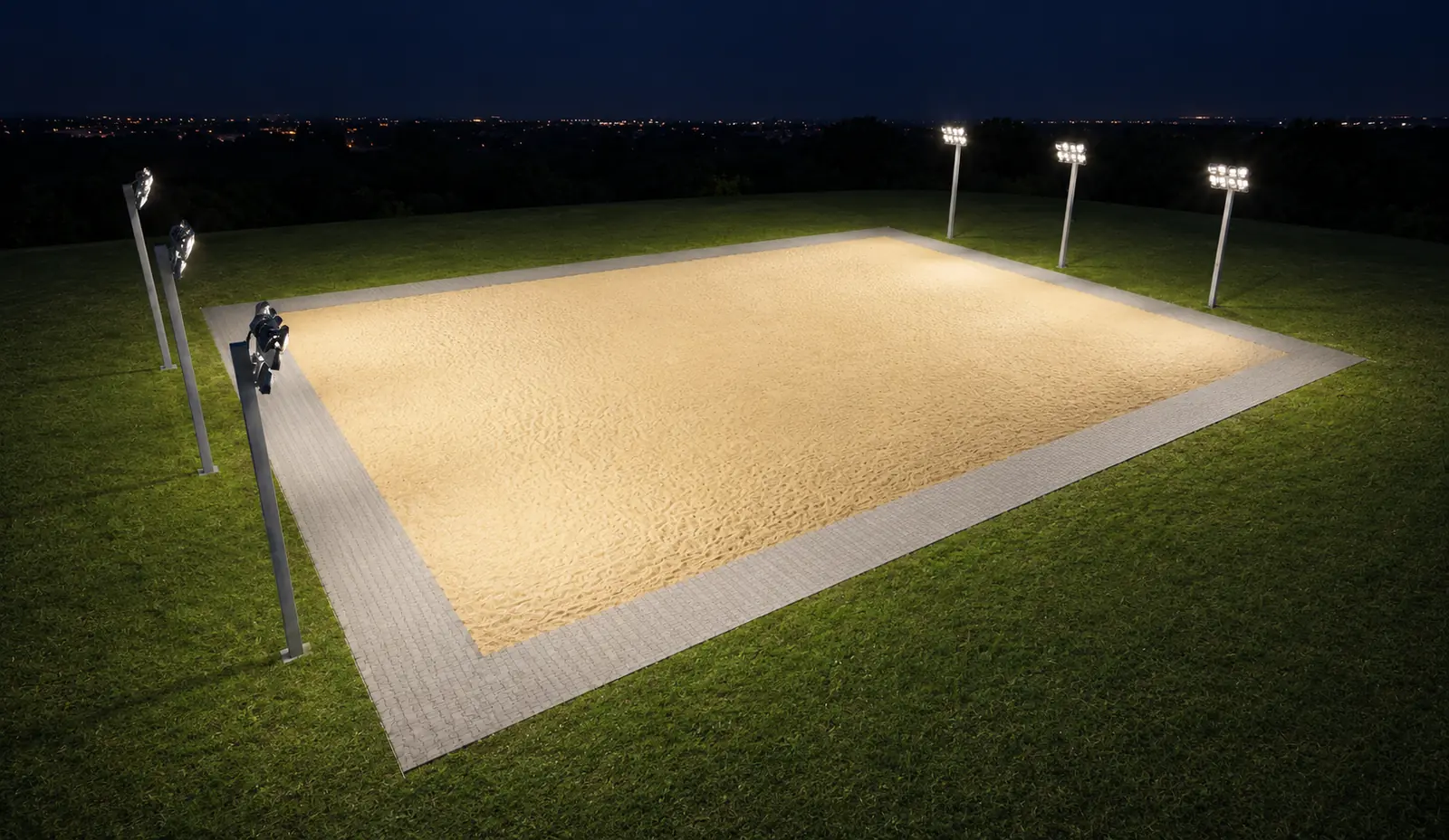 Vista noturna da arena de areia com o sistema de iluminação em funcionamento.